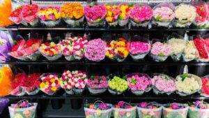 Colorful roses bouquet wall display in front of flower shop